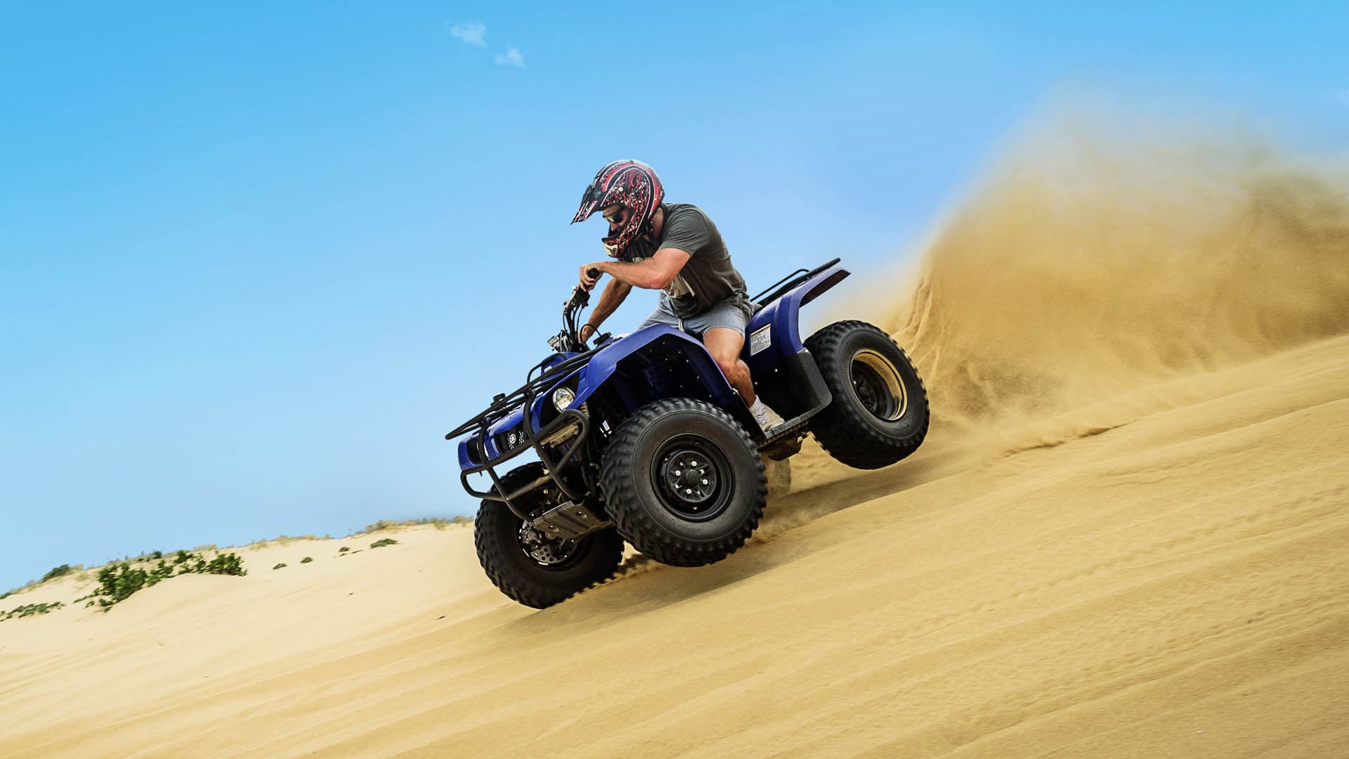 Quad biking across the Port Stephens sand dunes