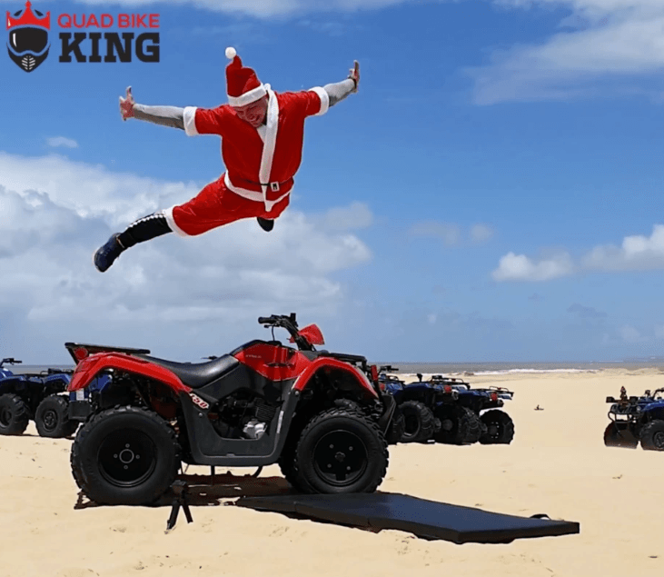 Former Quad Bike King staff performing acrobatic Christmas stunts on the Stockton sand dunes