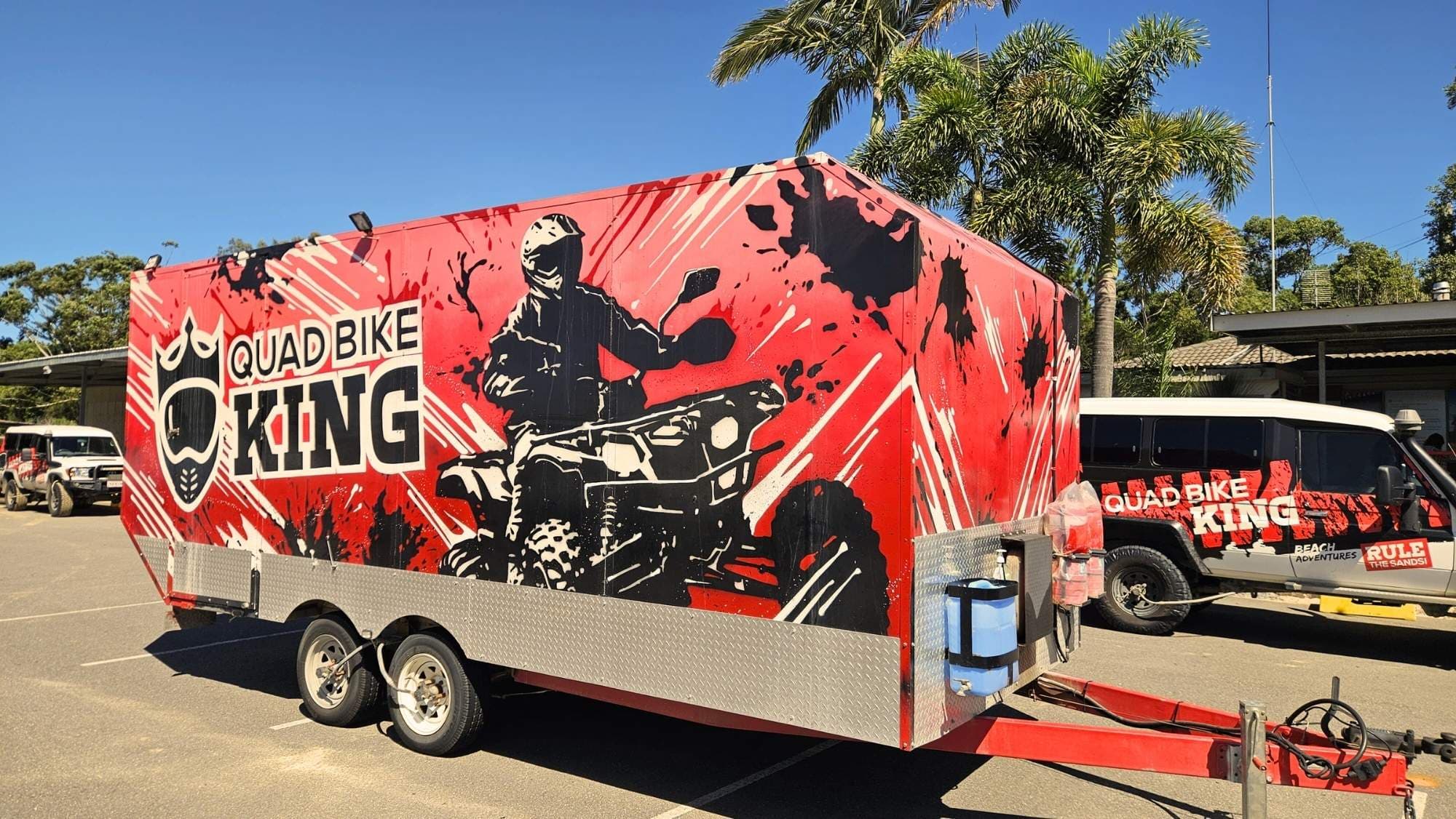 The Quad Bike King helmet trailer with new paint job parked at Stockton Beach