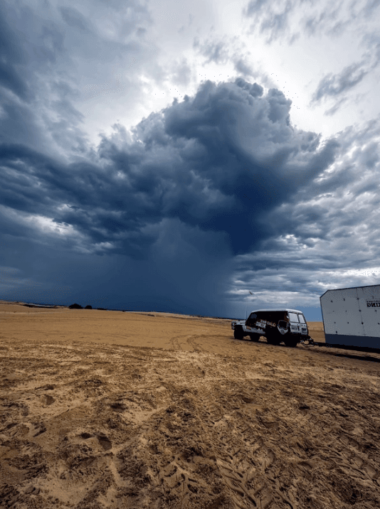 Mesocyclone storm front rolling across Stockton Beach during quad bike tours